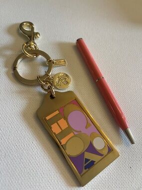 Coach Gold-tone Geo Enamel Keychain with Pink and Purple Accents and Coach Pen